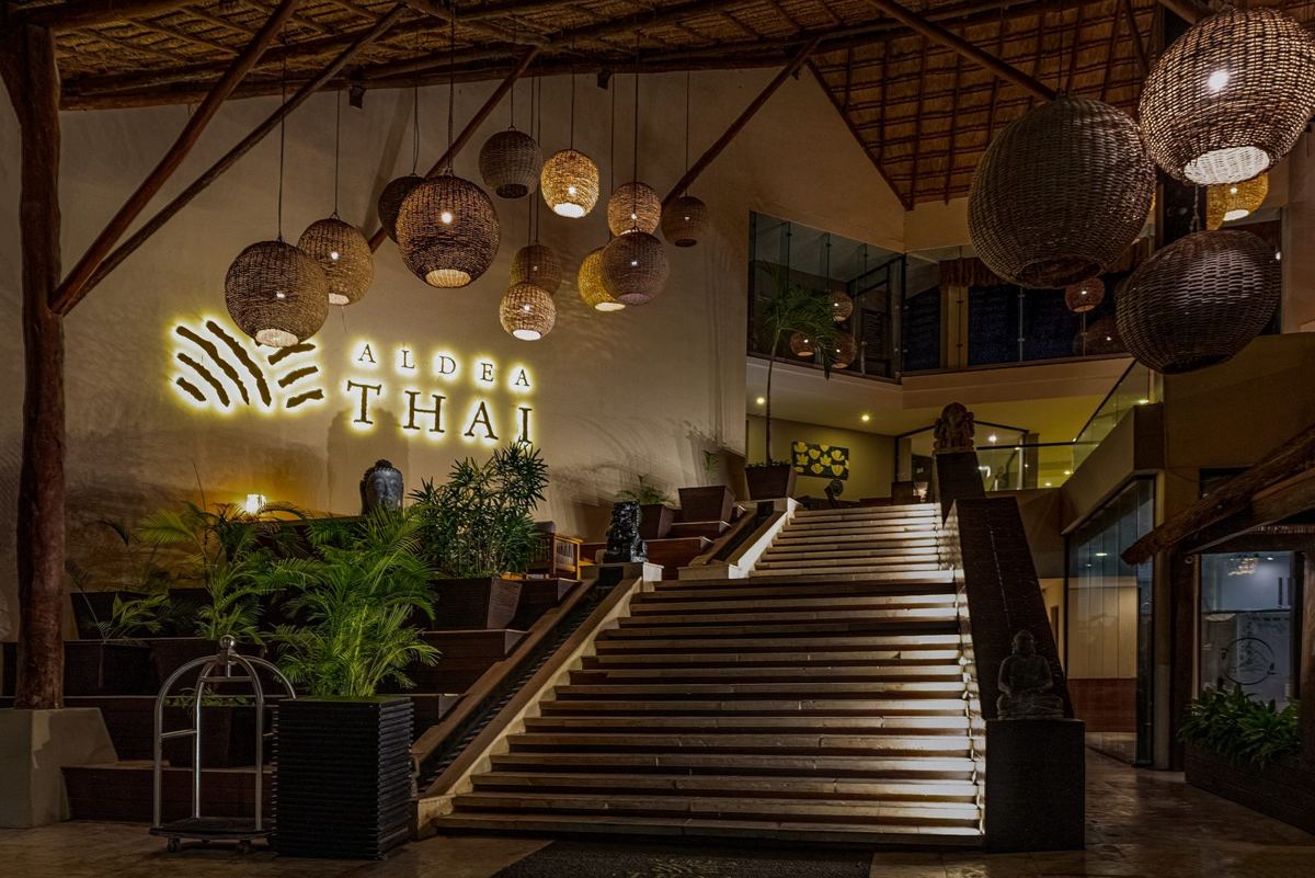 Woven rattan lanterns above the lobby stair